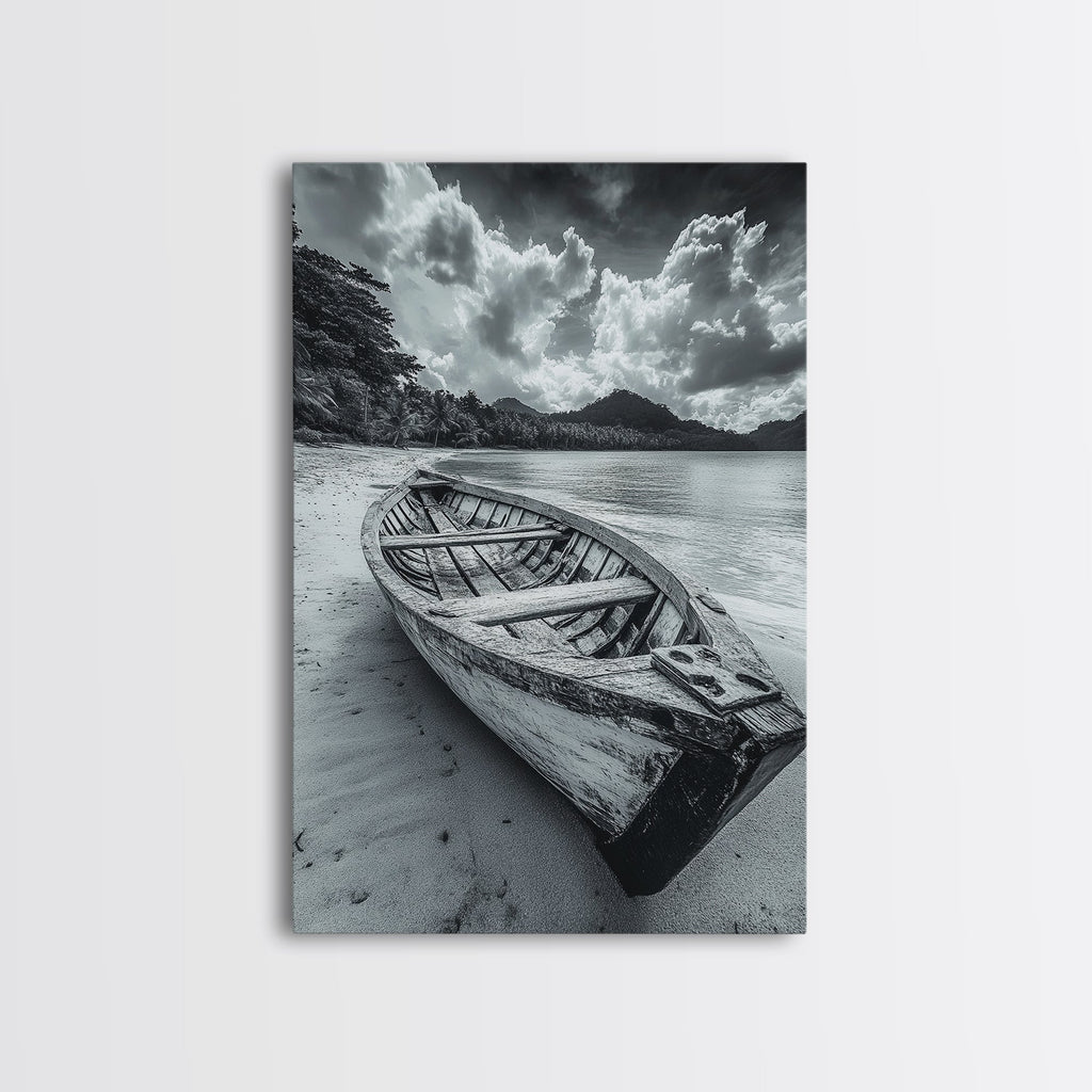 Black-and-white canvas print of an empty wooden rowboat on a shore beneath dramatic clouds.