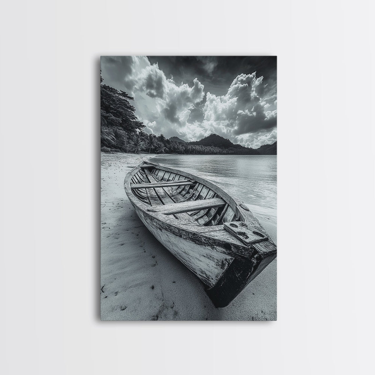 Black-and-white canvas print of an empty wooden rowboat on a shore beneath dramatic clouds.