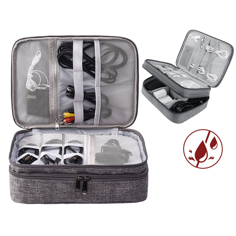 Open gray two-layer cable organizer case with cords and small devices in mesh and elastic compartments.