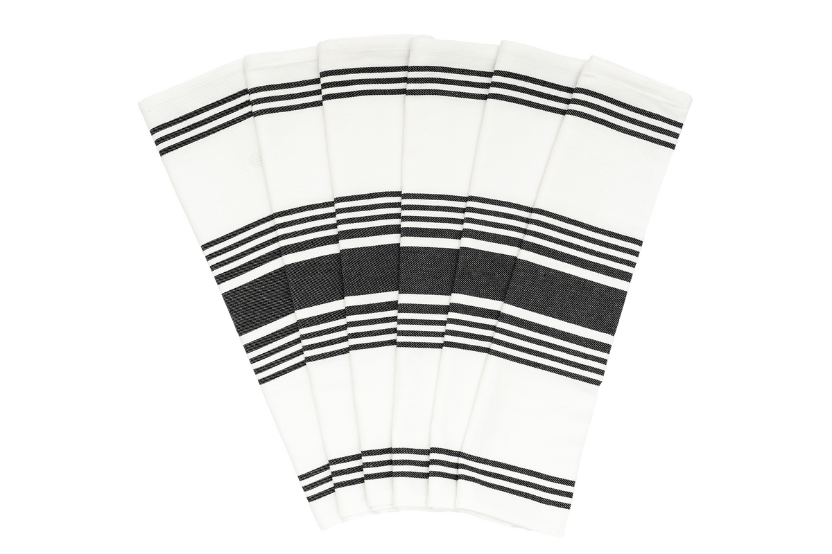 Six white cotton kitchen towels with black woven stripes arranged in a fan.