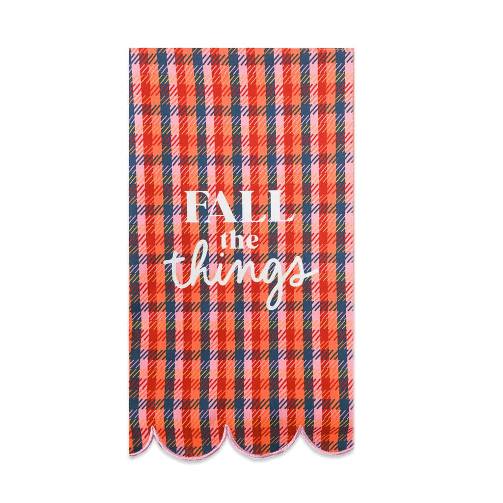 Red, orange and navy plaid tea towel with the white words FALL the things and scalloped edges.