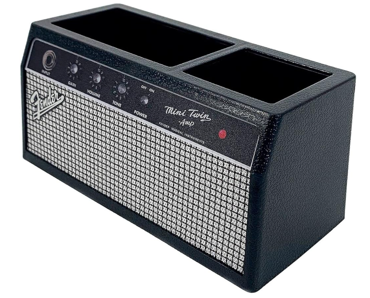 Black Fender amplifier-style desk organizer for pens, phone, and small office tools.
