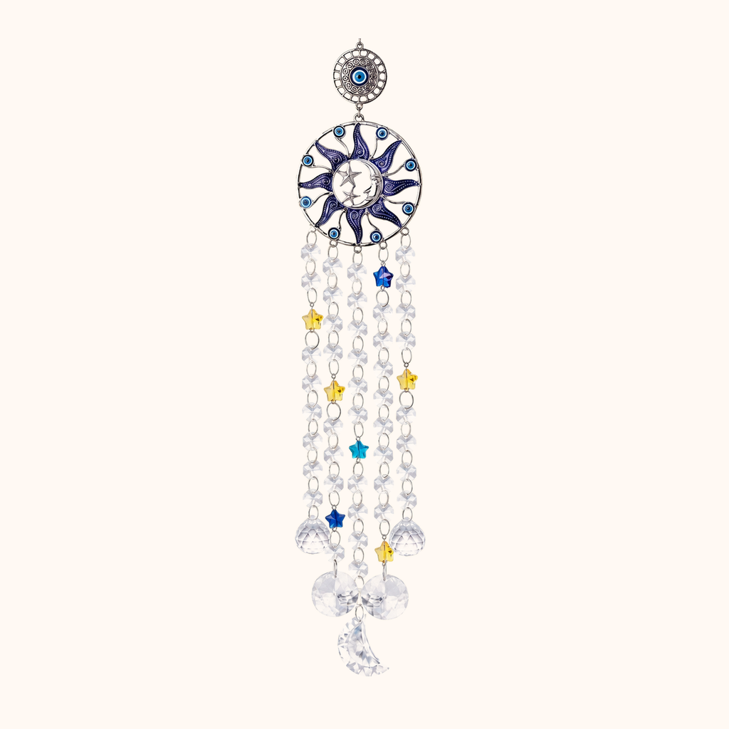 Blue evil-eye-style circular hanging ornament with clear crystals, stars and a crescent moon.