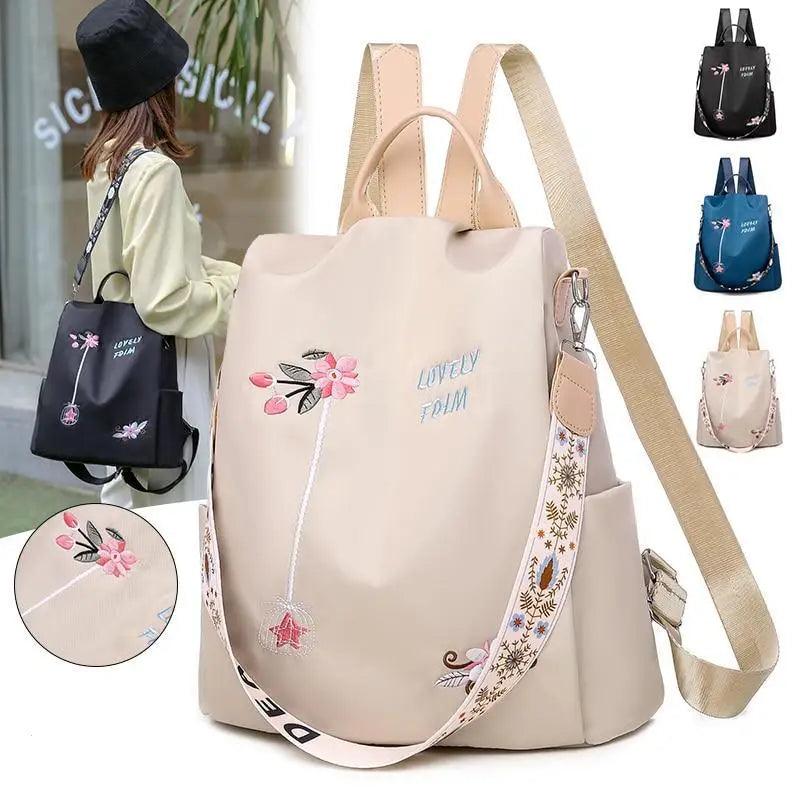 Cream embroidered backpack with floral designs and patterned strap, with small color-variant images beside it.