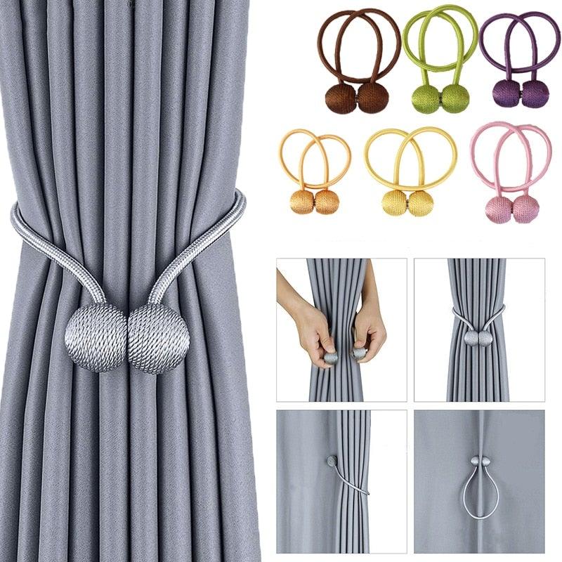 Gray curtains gathered with a silver ball-ended tieback, alongside small photos of color options and fastening styles.