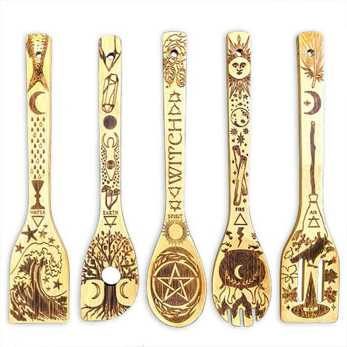 Five engraved bamboo kitchen utensils arranged on a white background.