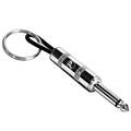 Silver-tone guitar-jack plug keychain with metal keyring on a black background.